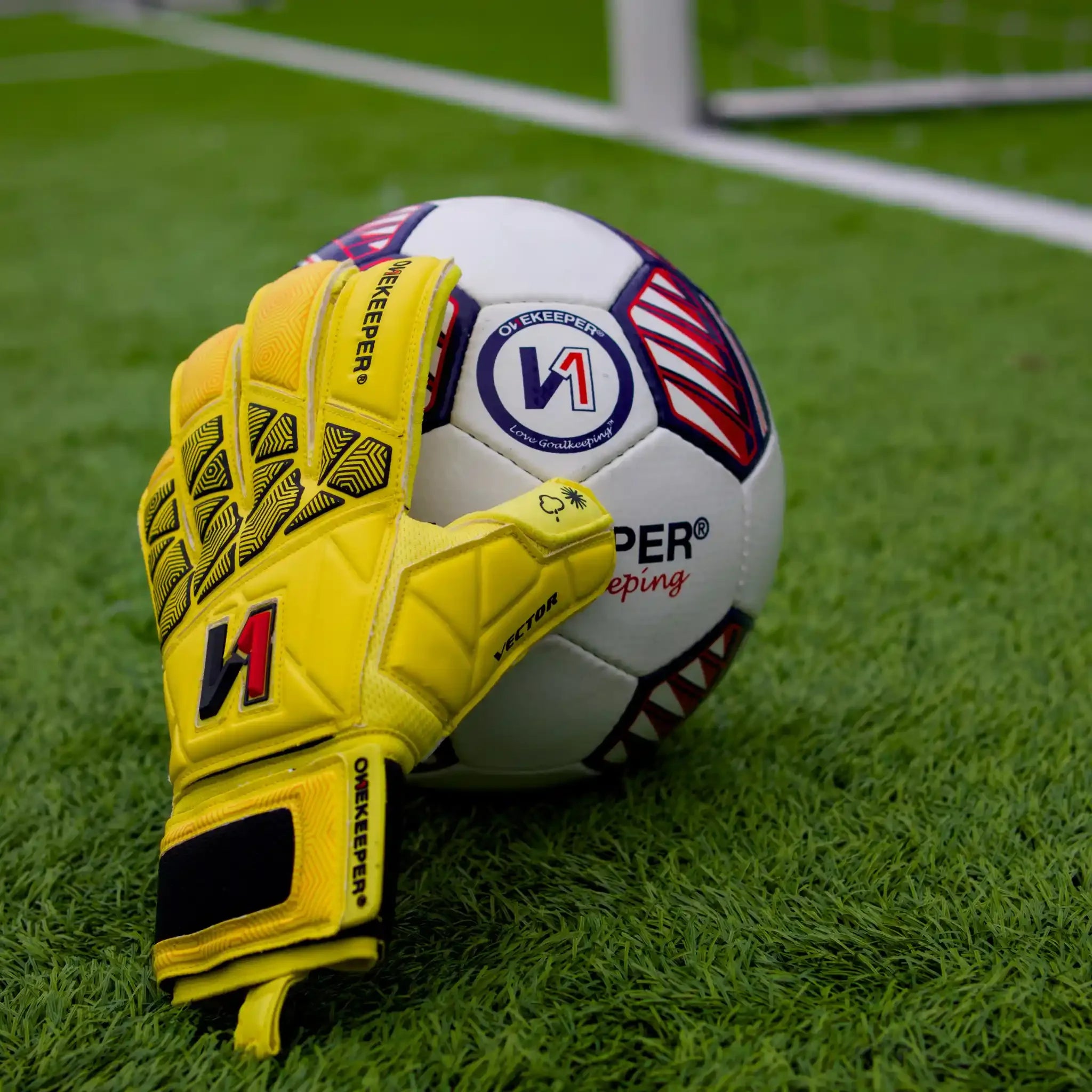 ONEKEEPER Vector Junior Yellow Glove over the Ball
