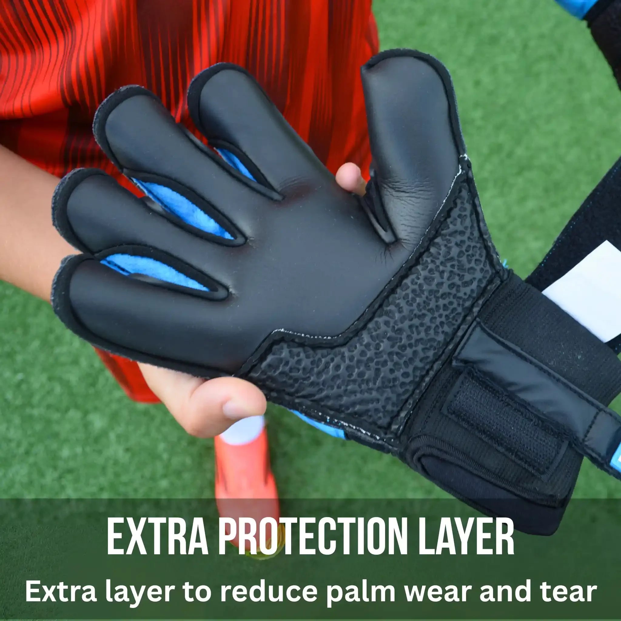 ONEKEEPER Vector Evolution Blue goalkeeper glove with text 'Extra Protection Layer' on the palm on a green background