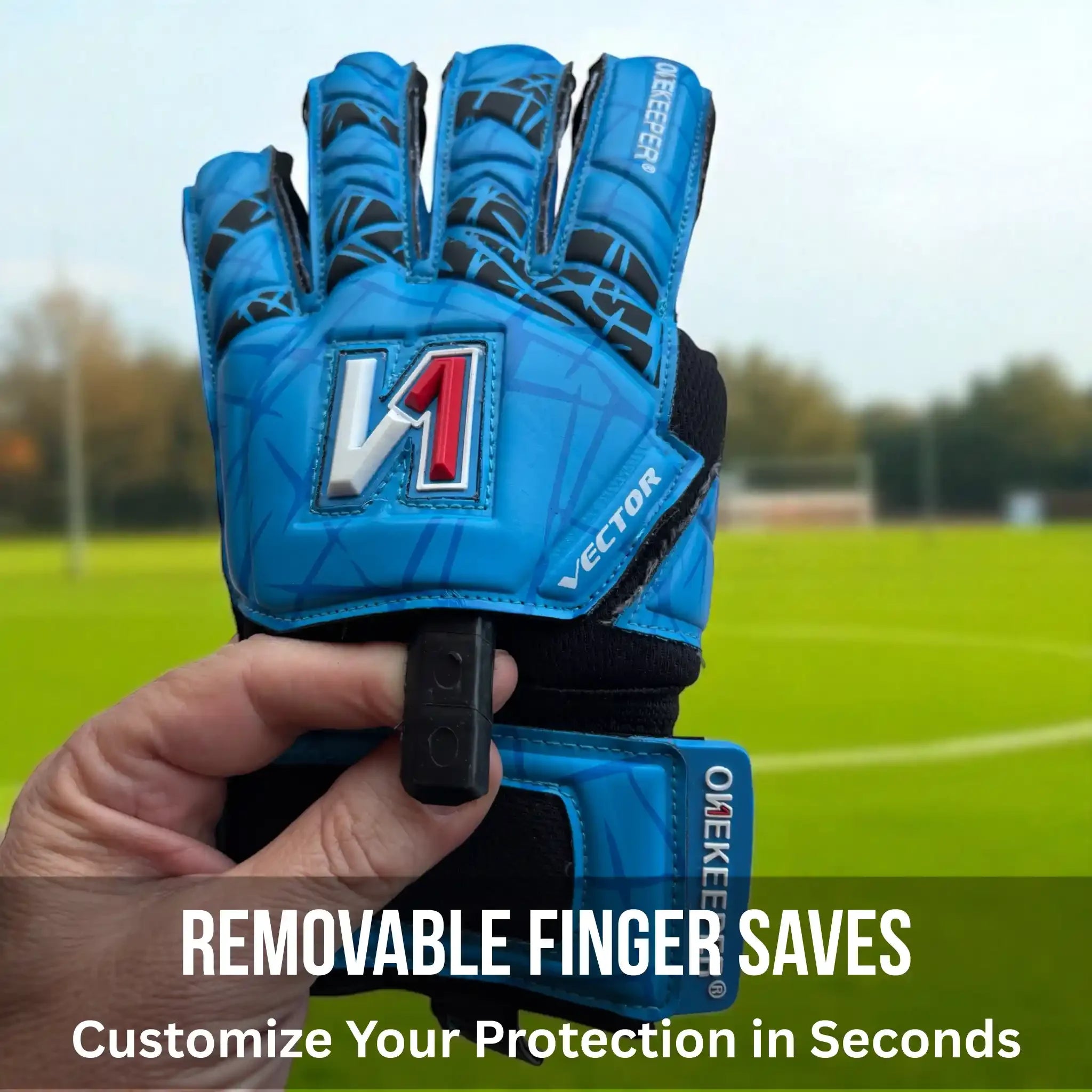 ONEKEEPER Vector Evolution Blue goalkeeper glove with removable finger saves held by a hand on a sports field background.