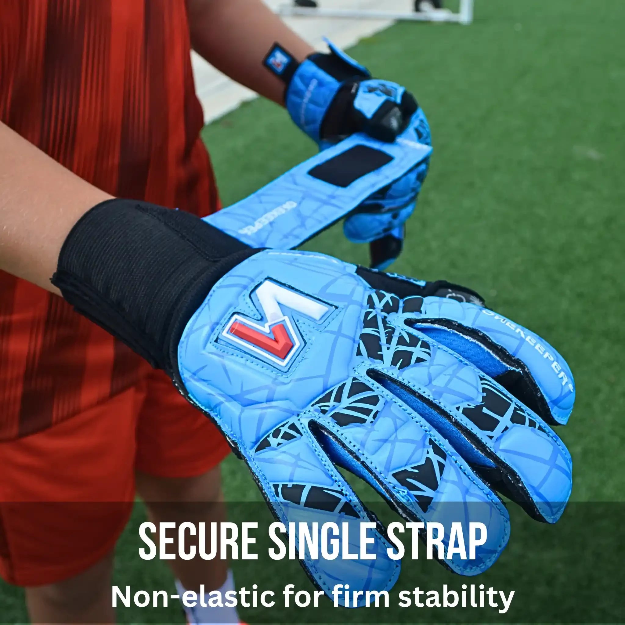 ONEKEEPER Vector Evolution Blue goalkeeper gloves with a secure single strap on a sports field background