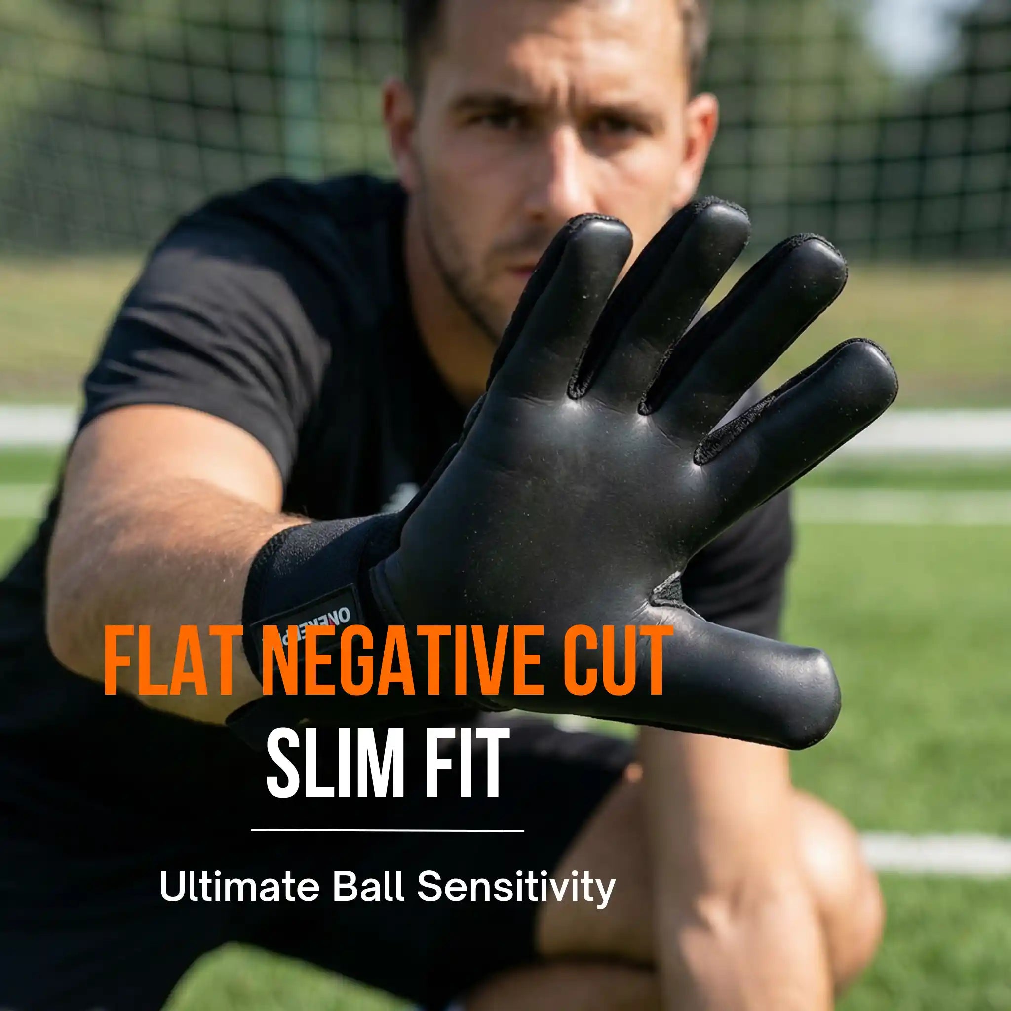 Person wearing a onekeeper ace black glove with text about glove features on a sports field background