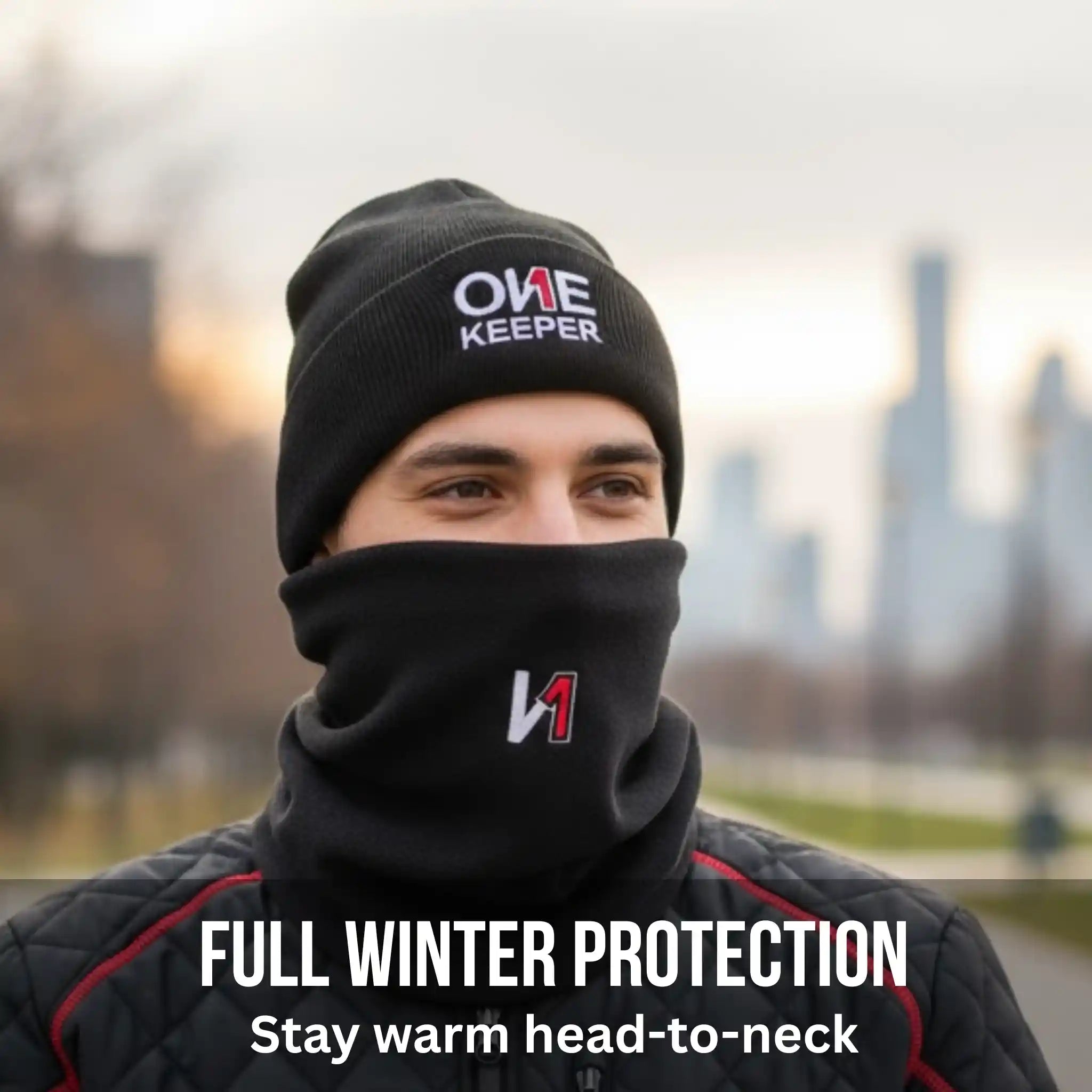 Person wearing a black onekeeper beanie and scarf with 'ONE KEEPER' branding, set against an outdoor background.