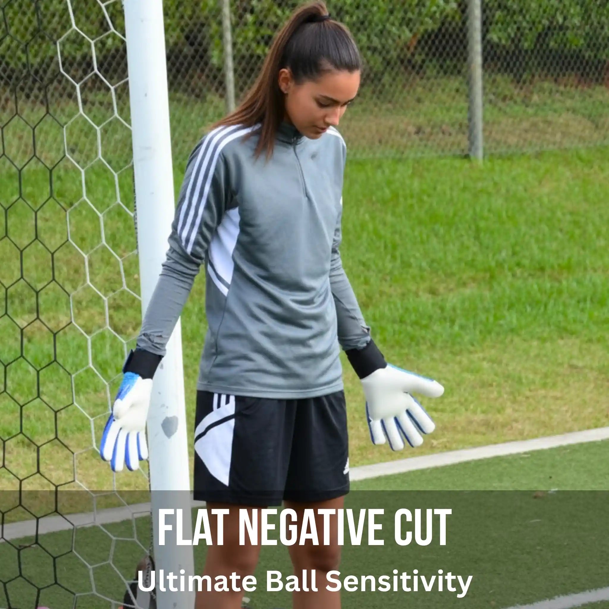 Person in onekeeper c-tec aqua goalkeeper gloves standing next to a goalpost on a grassy field with text 'Flat Negative Cut Ultimate Ball Sensitivity'.
