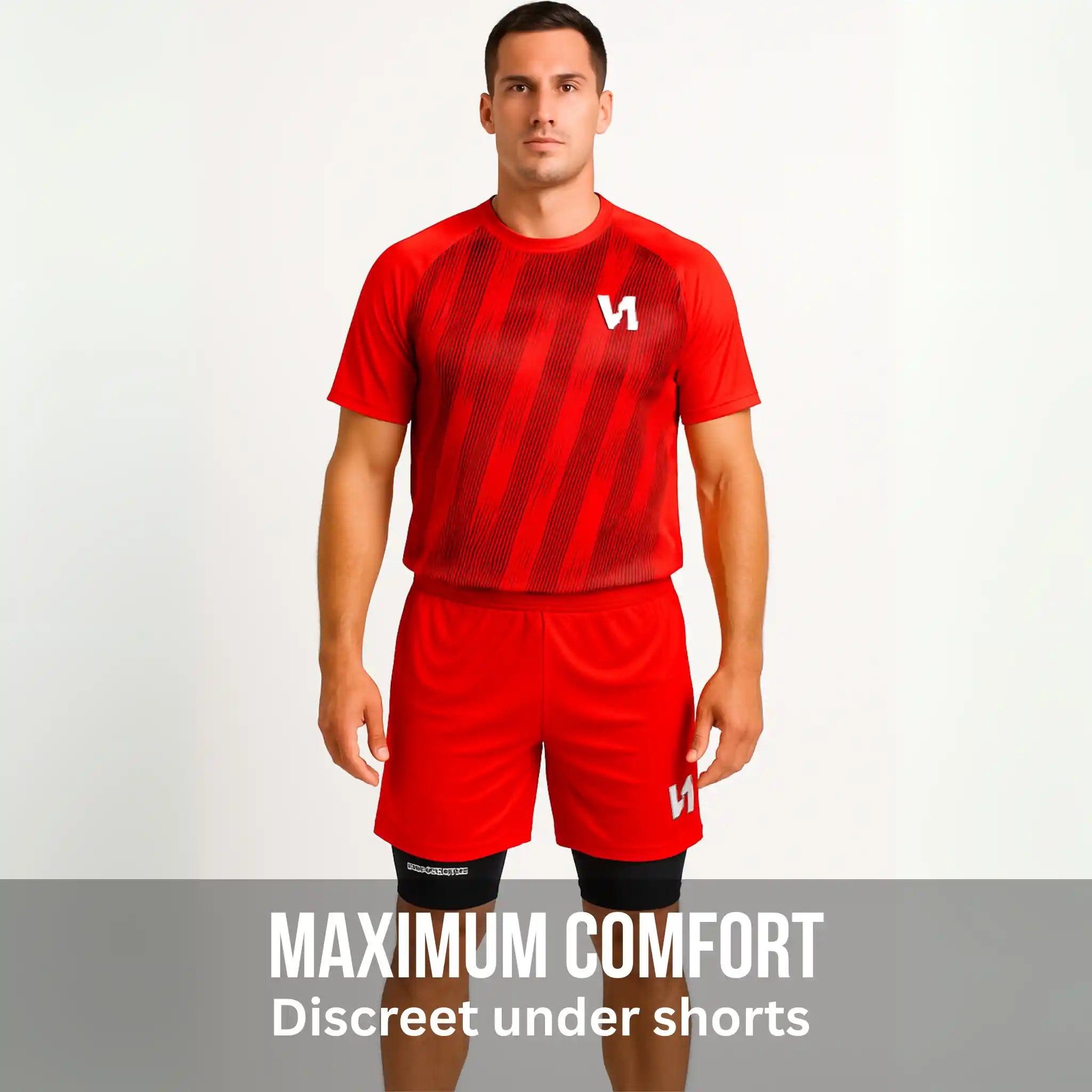 Man wearing a red sports outfit with a logo on a gray background with a onekeeper compression padded short pro