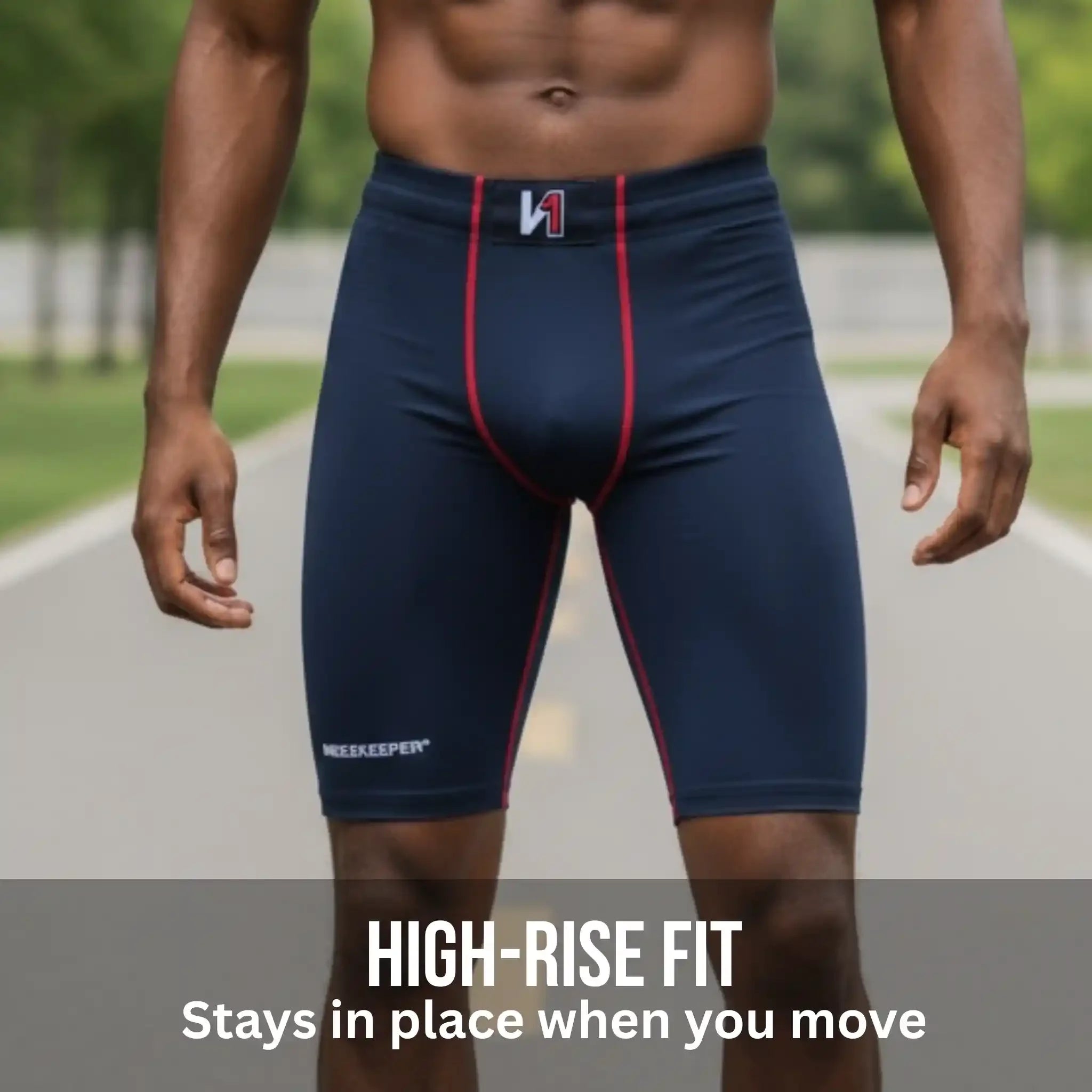 Person wearing onekeeper compression shorts black with red accents on a blurred outdoor background
