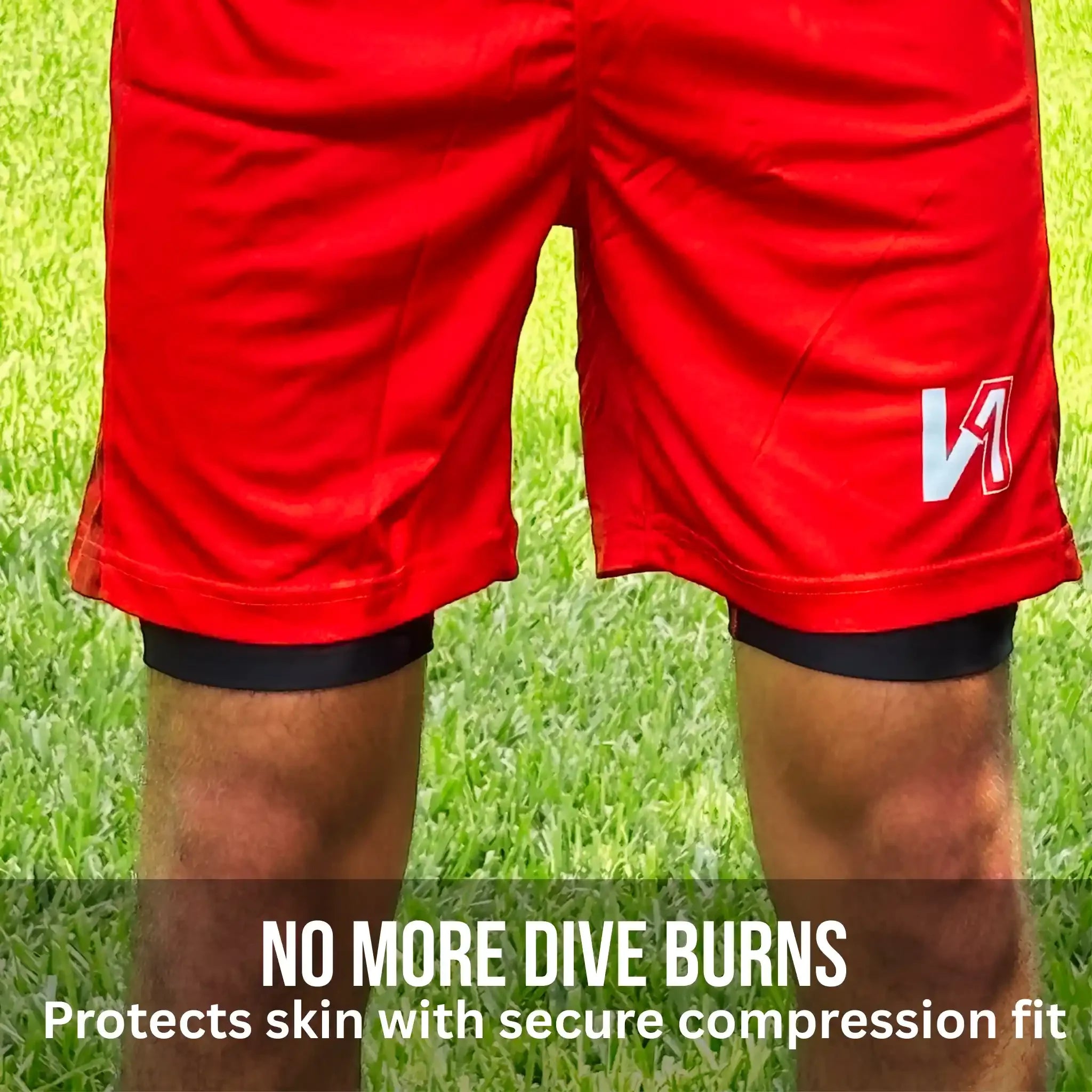 Red shorts with a logo on a grass background, promoting onekeeper compression shorts skin protection from dive burns.