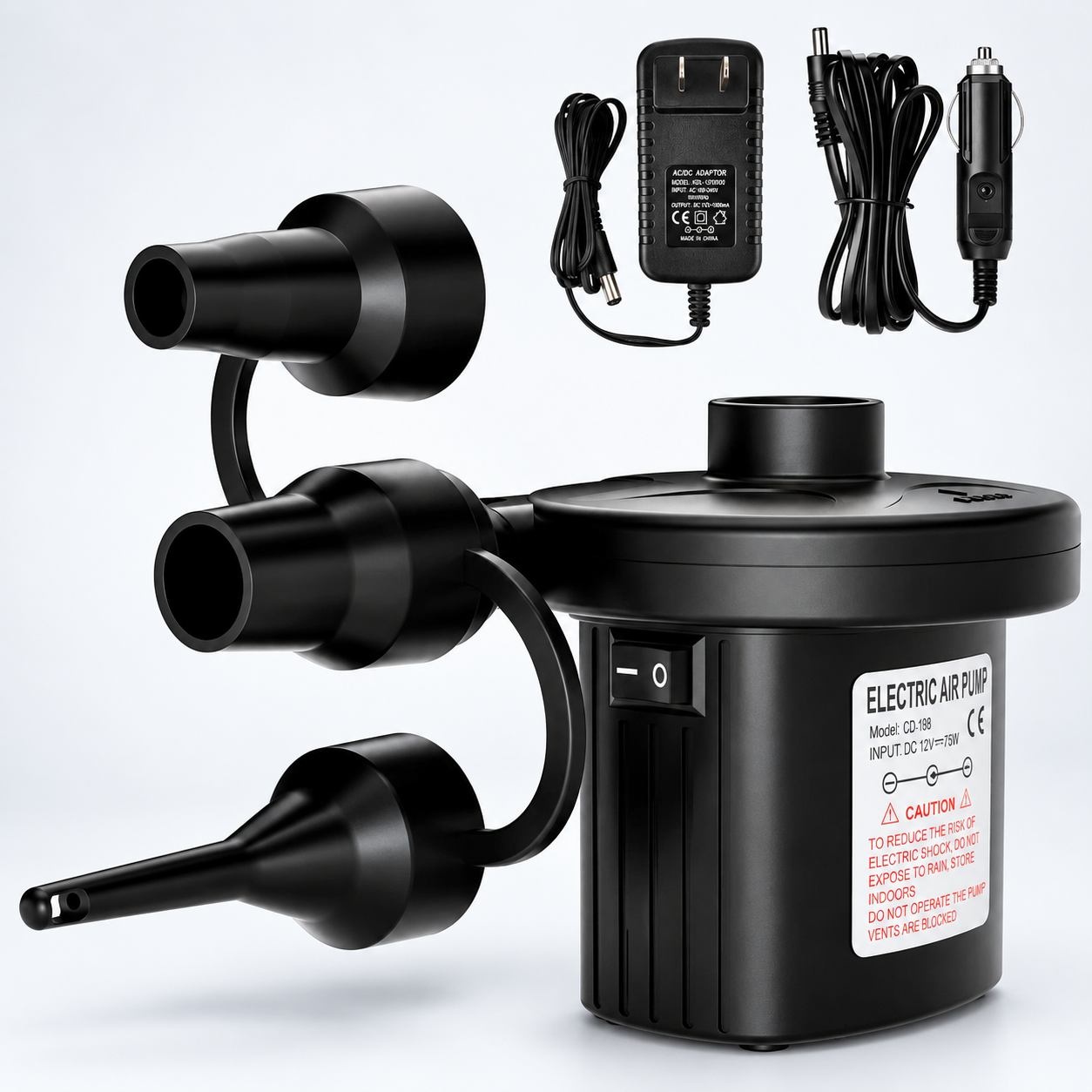 Black electric air pump with three nozzle attachments, shown with a power adapter and car cigarette lighter charger on a light gray background.