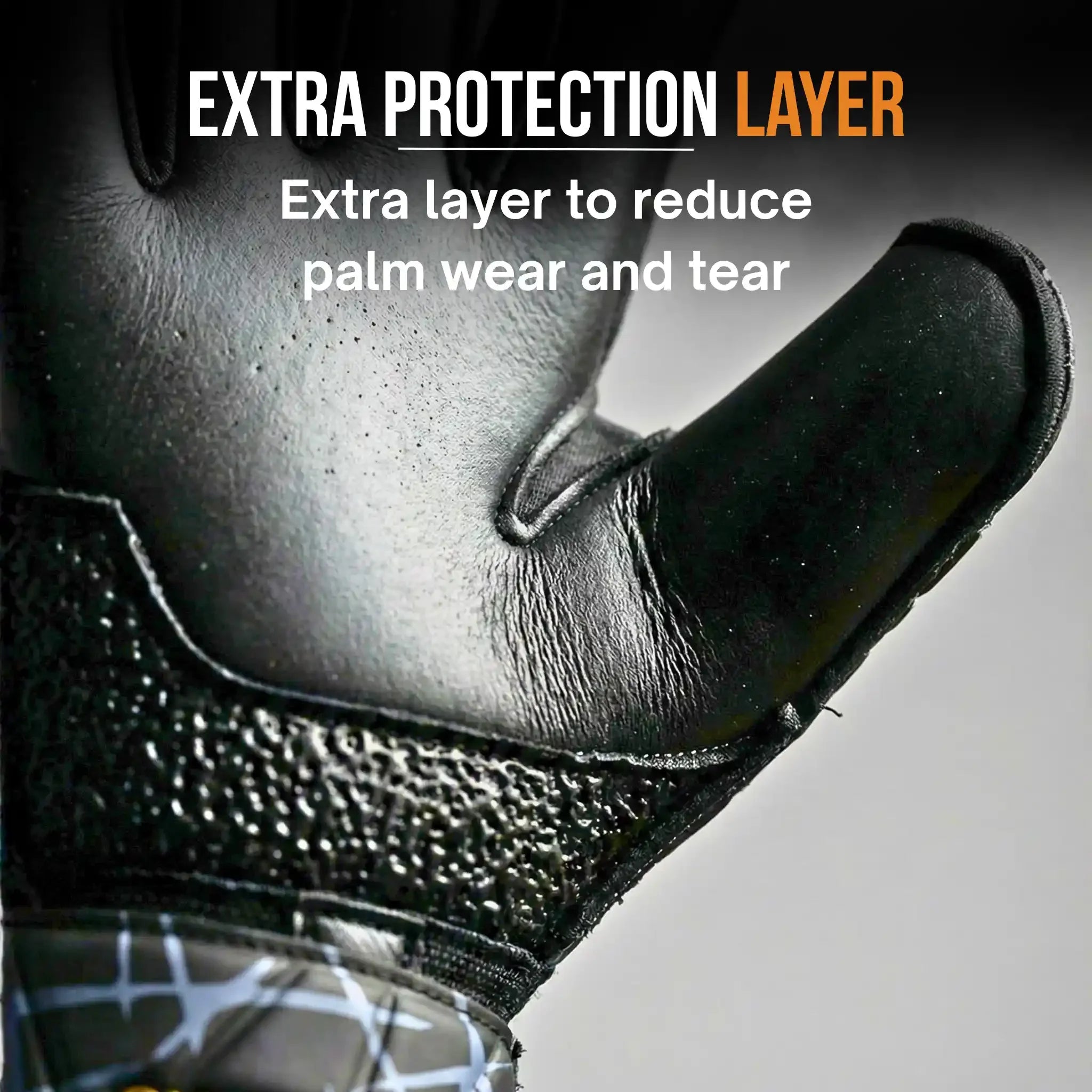 Close-up of a onekeeper vector evolution black and gold glove with an extra protection layer on the palm, text indicating it reduces wear and tear.