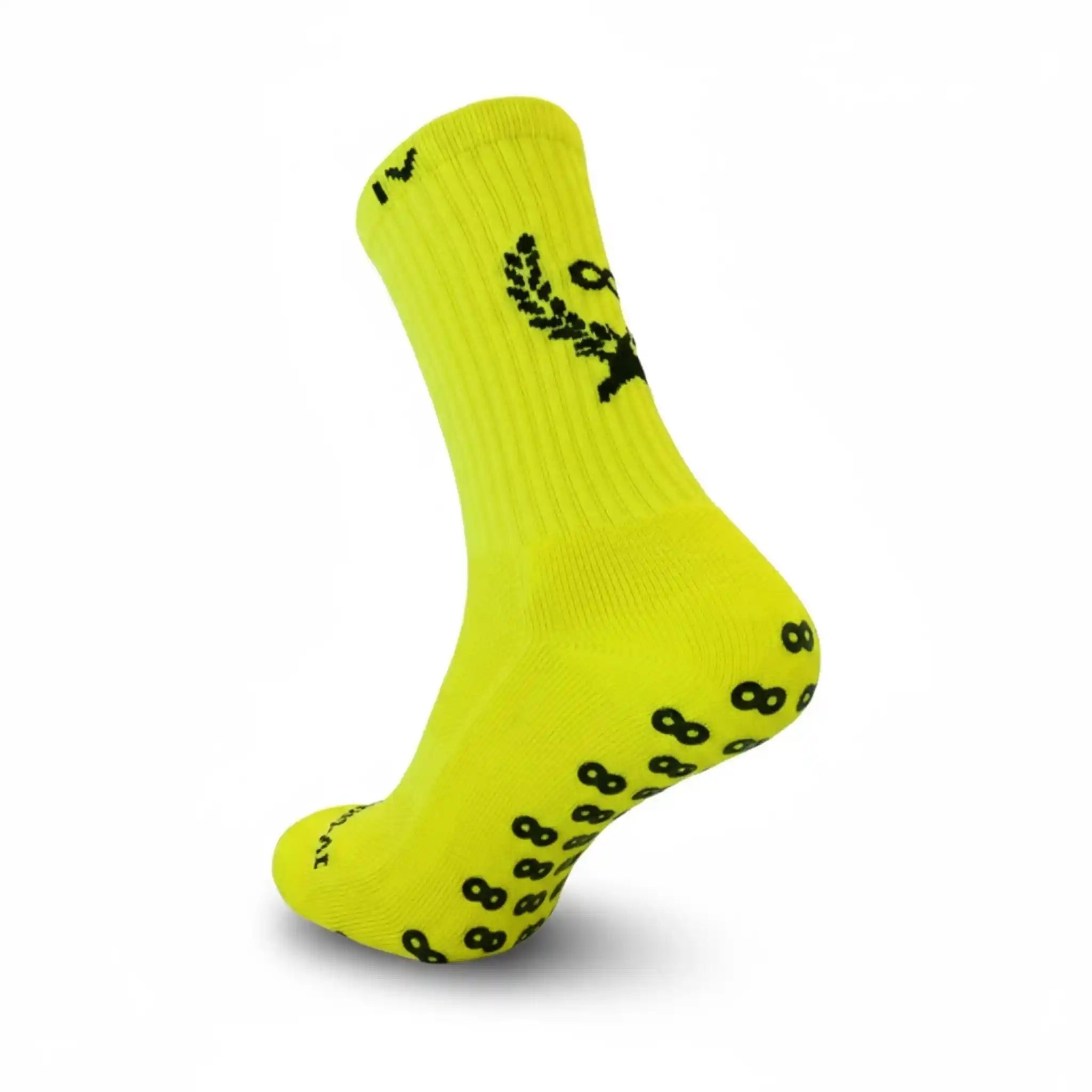 Yellow grip sock with black patterns on a white background