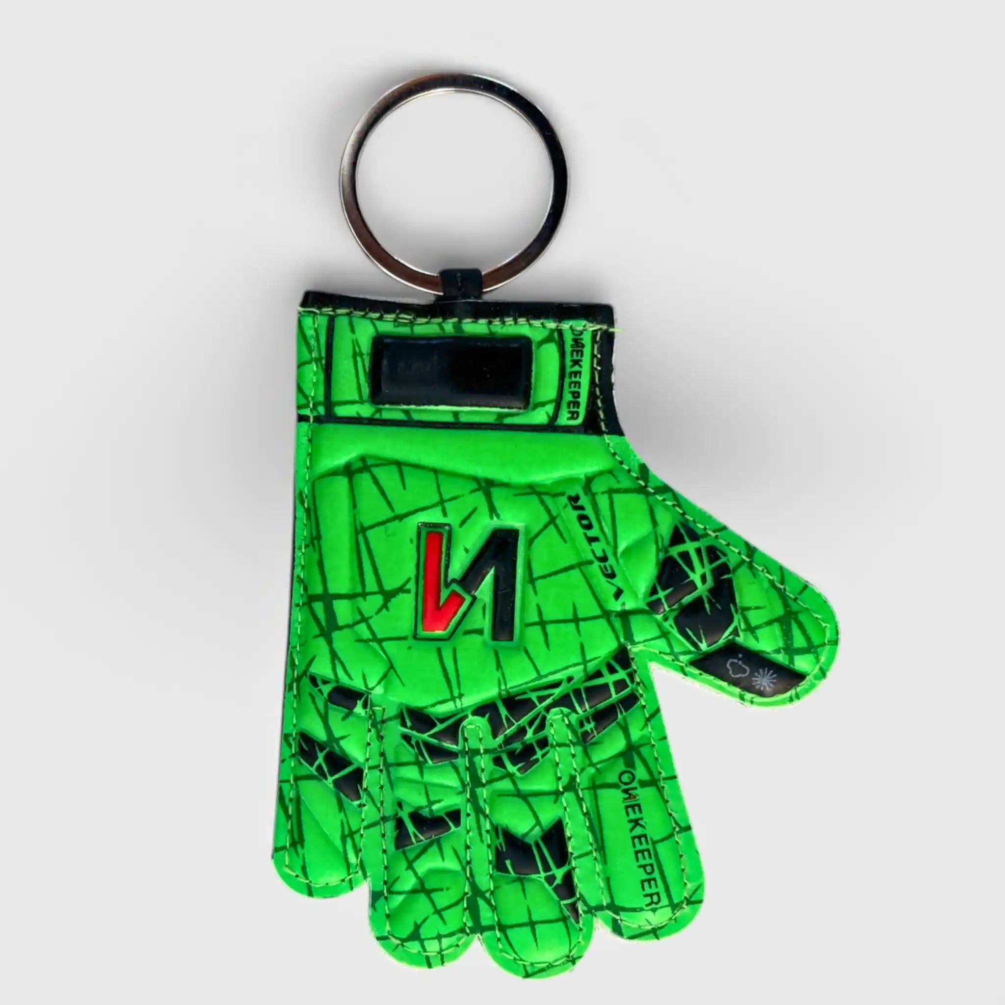 onekeeper vector evolution Green keychain shaped like a soccer goalkeeper glove with a brand logo on a white background