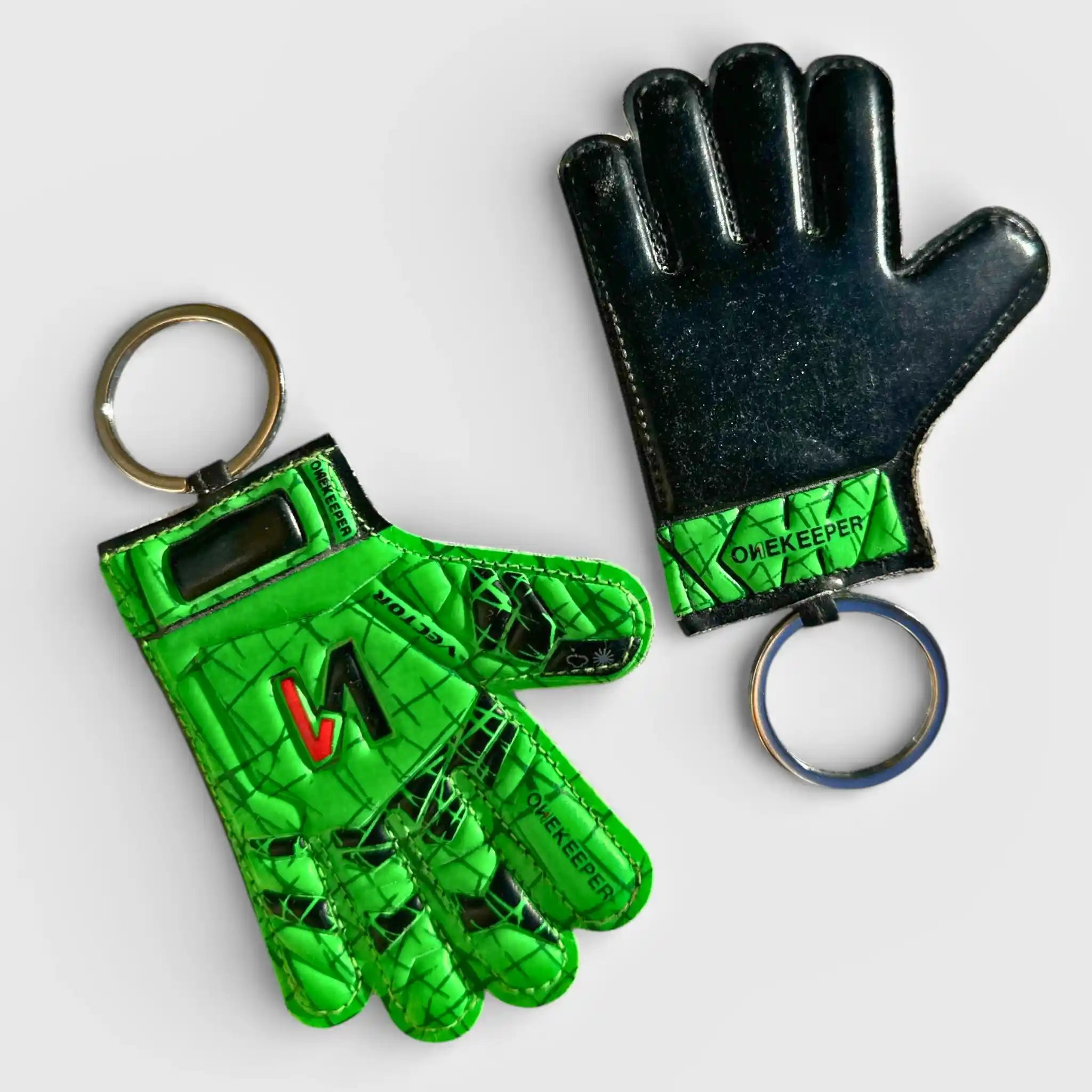 onekeeper Green and black keychain gloves with 'OPEKEEPER' branding on a white background