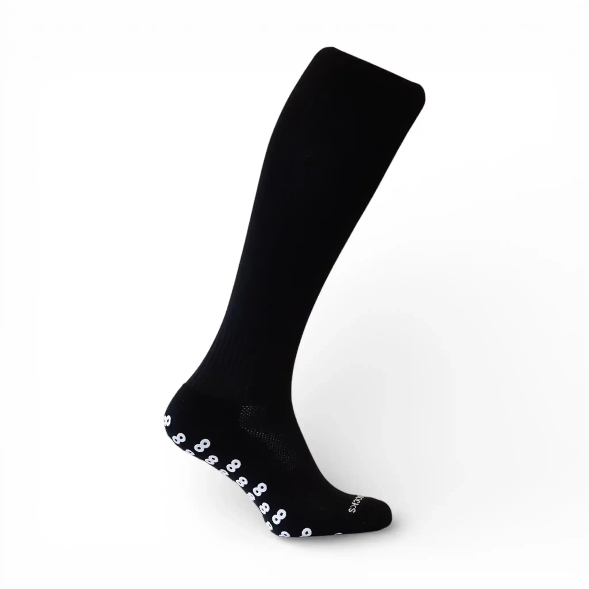 Black knee-high long grip sock with white paw prints on a white background