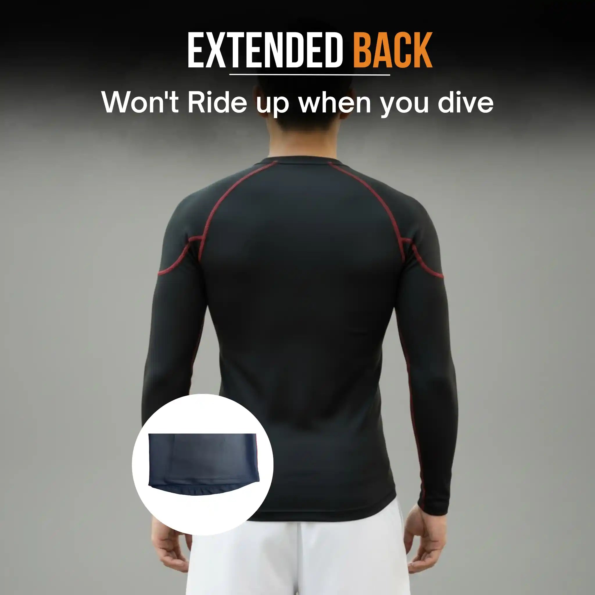 Person wearing a onekeeper black long-sleeve compression shirt with an extended back design on a gray background.