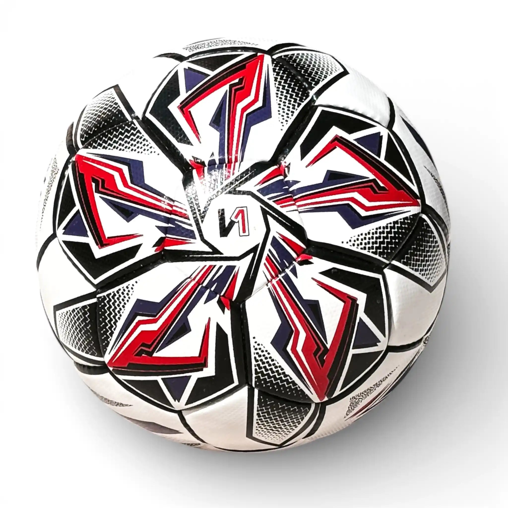 Soccer ball with red and blue geometric patterns on a white background