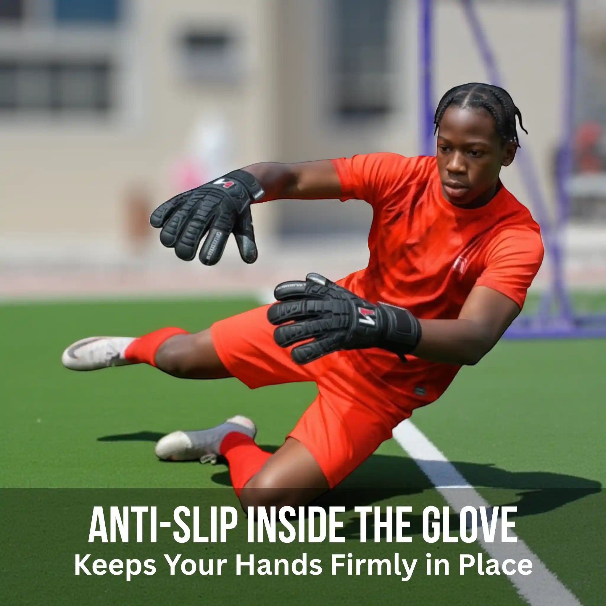 Person in red sports outfit with onekeeper solid black gloves on a sports field, promoting anti-slip gloves.