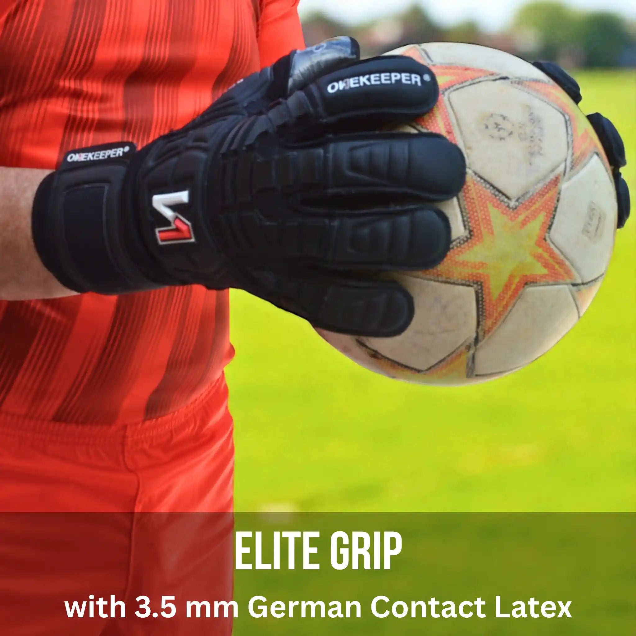 Person wearing the ONEKEEPER Solid black goalkeeper gloves holding a soccer ball on a grassy field