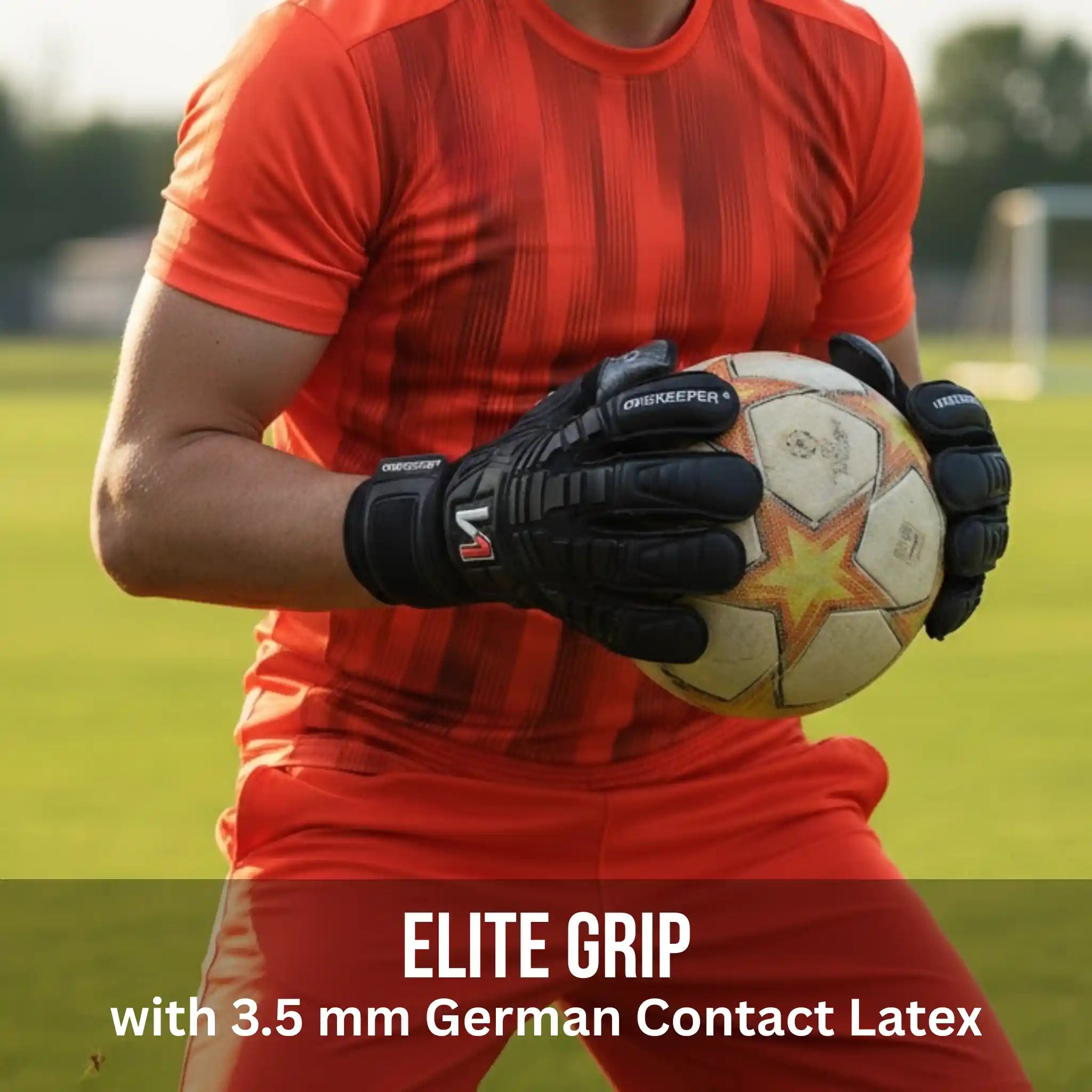 Person in red sports outfit holding a soccer ball with a onekeeper solid black gloves on a grassy field.