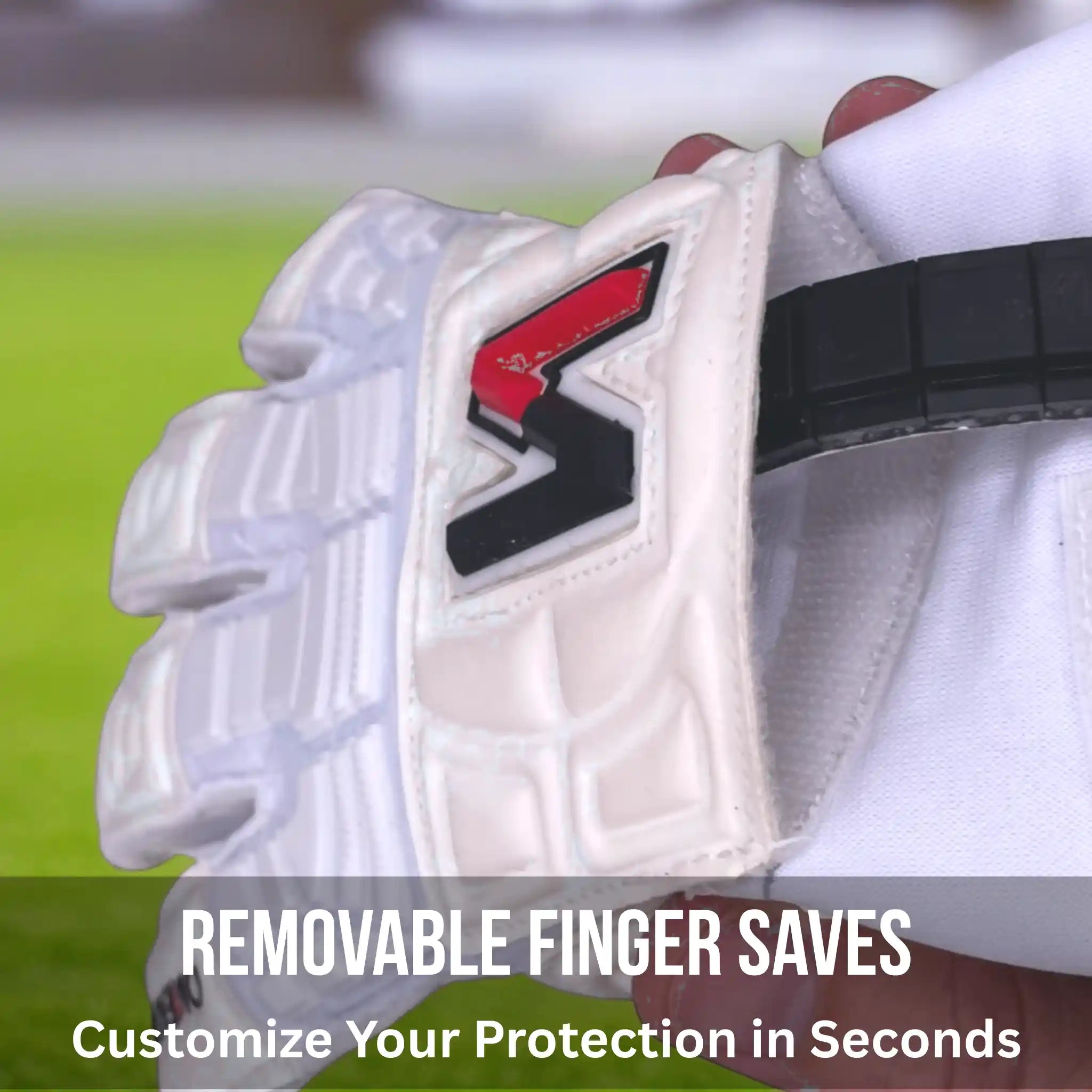 Close-up of a ONEKEEPER Solid White glove with a brand logo, on a blurred green field background.
