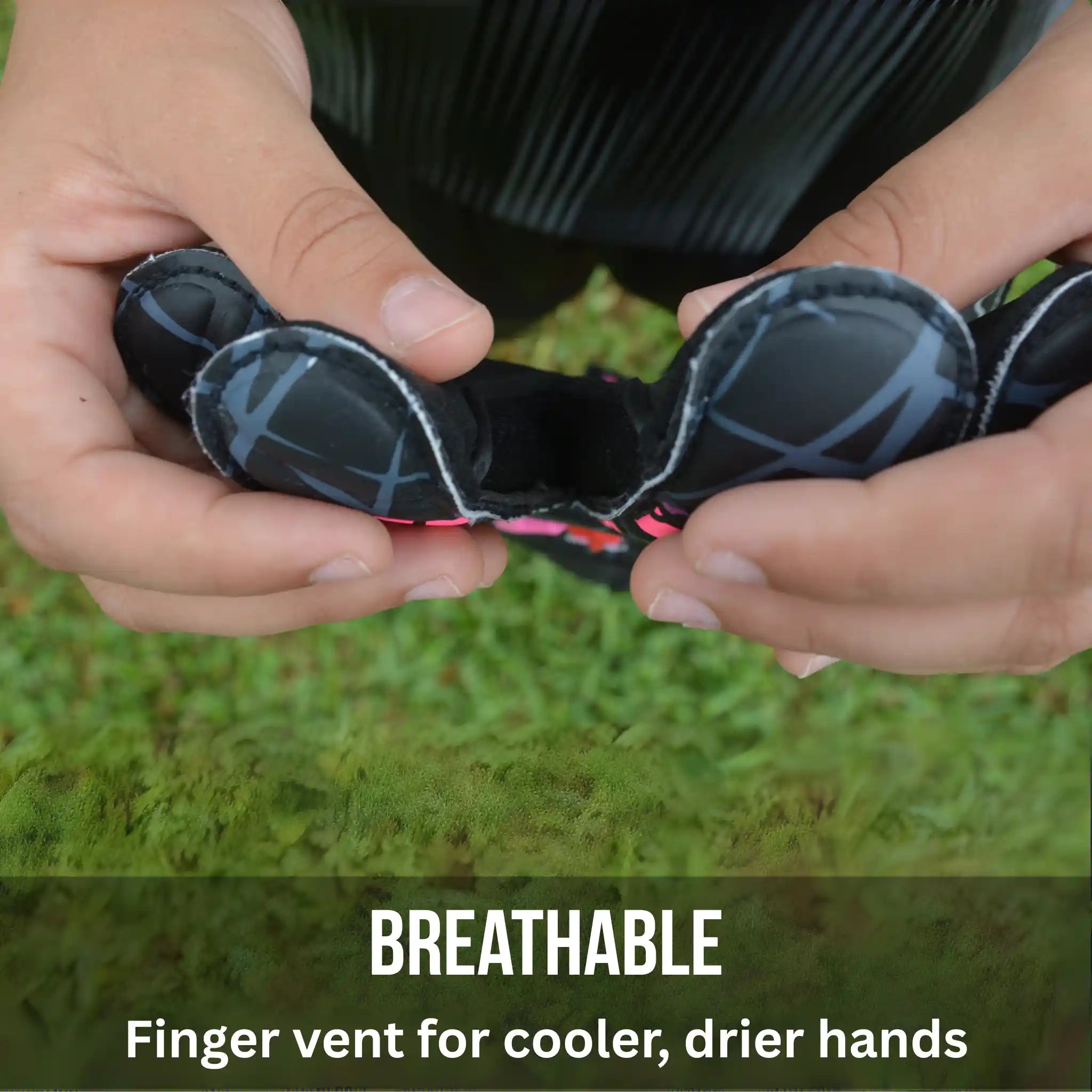 ONEKEEPER Vector Evolution Black and Pink - Hands holding a finger vent with grass in the background