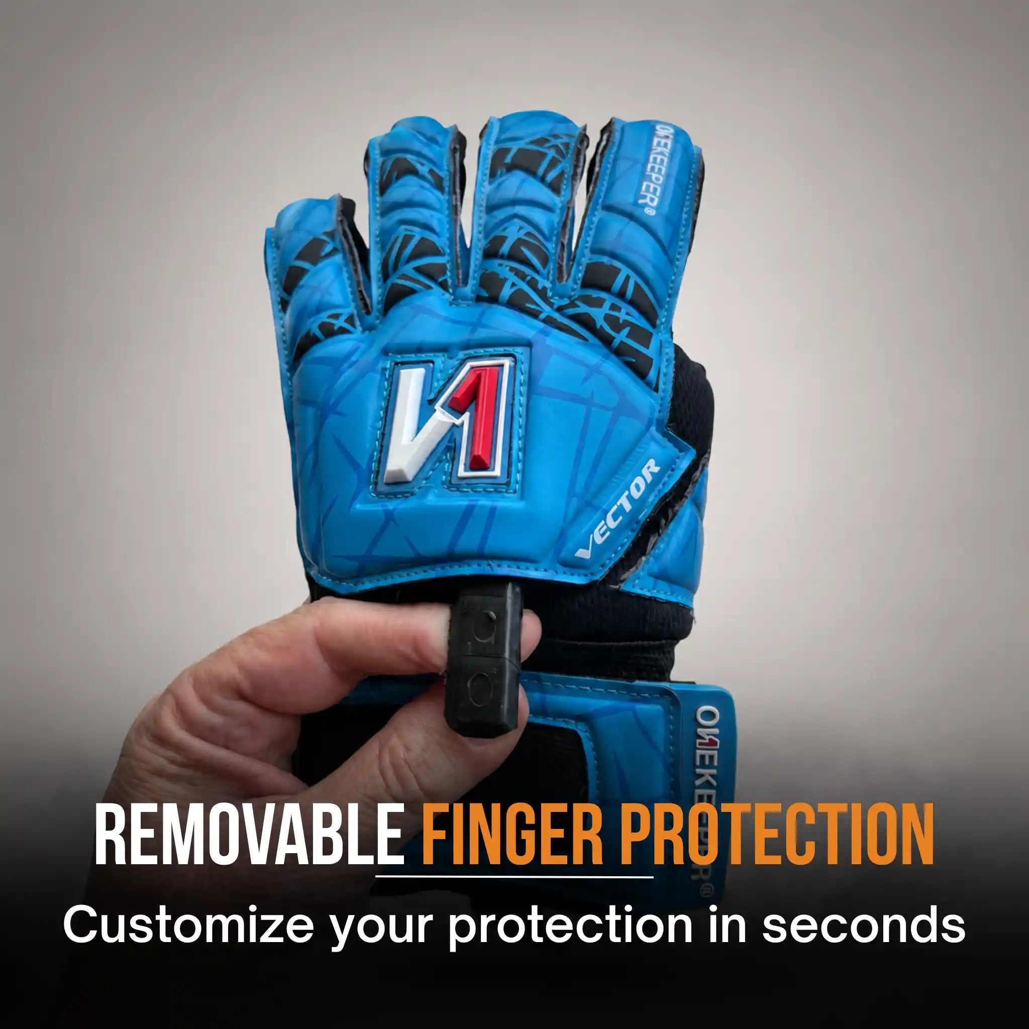 onekeeper vector evolution Blue glove with removable finger protection held by a hand on a gray background