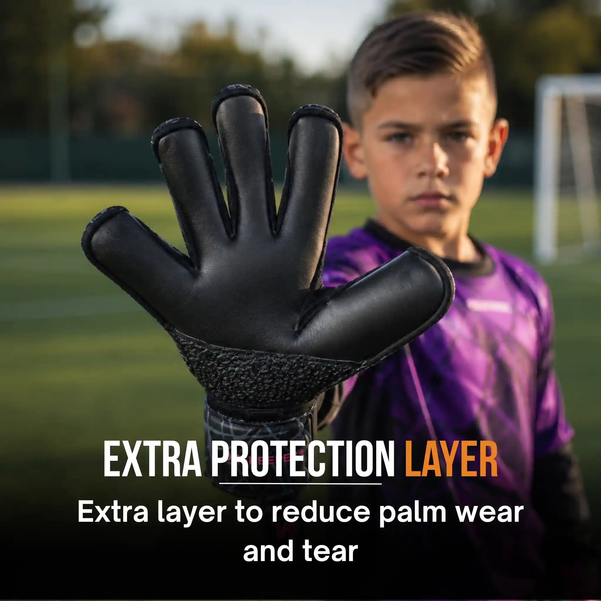Kid showing the palm of the ONEKEEPER Vector Evolutino black and purple.