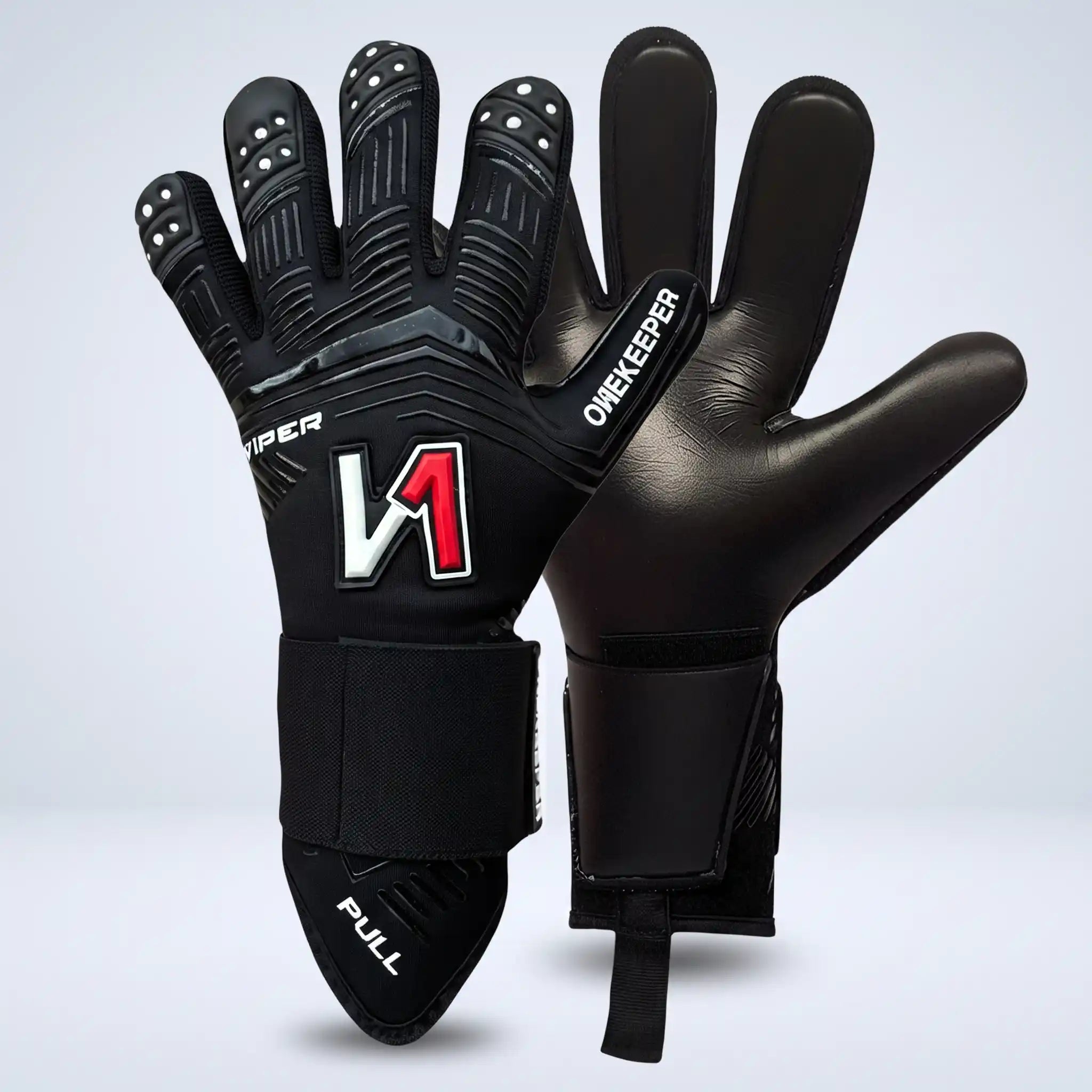 A pair of onekeeper viper black goalkeeper gloves shown against a light gray studio background. One glove is oriented to show the back of the hand with textured finger pads, a large stylized 'V1' logo in white and red, and 'ONEKEEPER' text on the side.