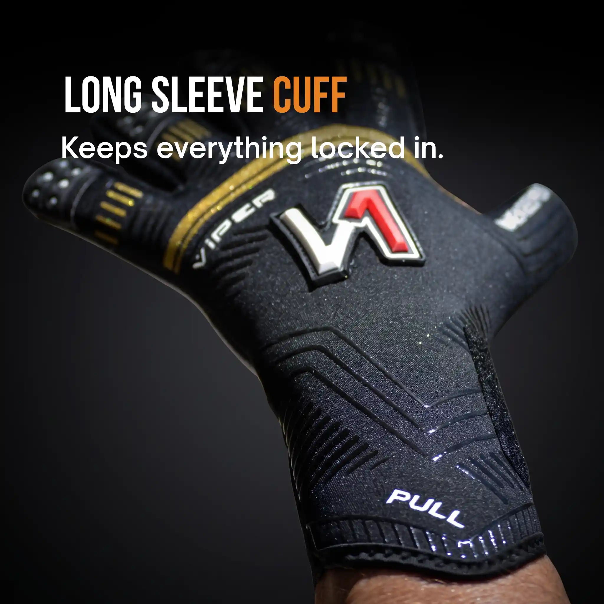 A onekeeper viper black and gold long sleeve cuff glove with gold and red accents, shown on a hand against a dark background with text overlay reading 'LONG SLEEVE CUFF Keeps everything locked in.'.