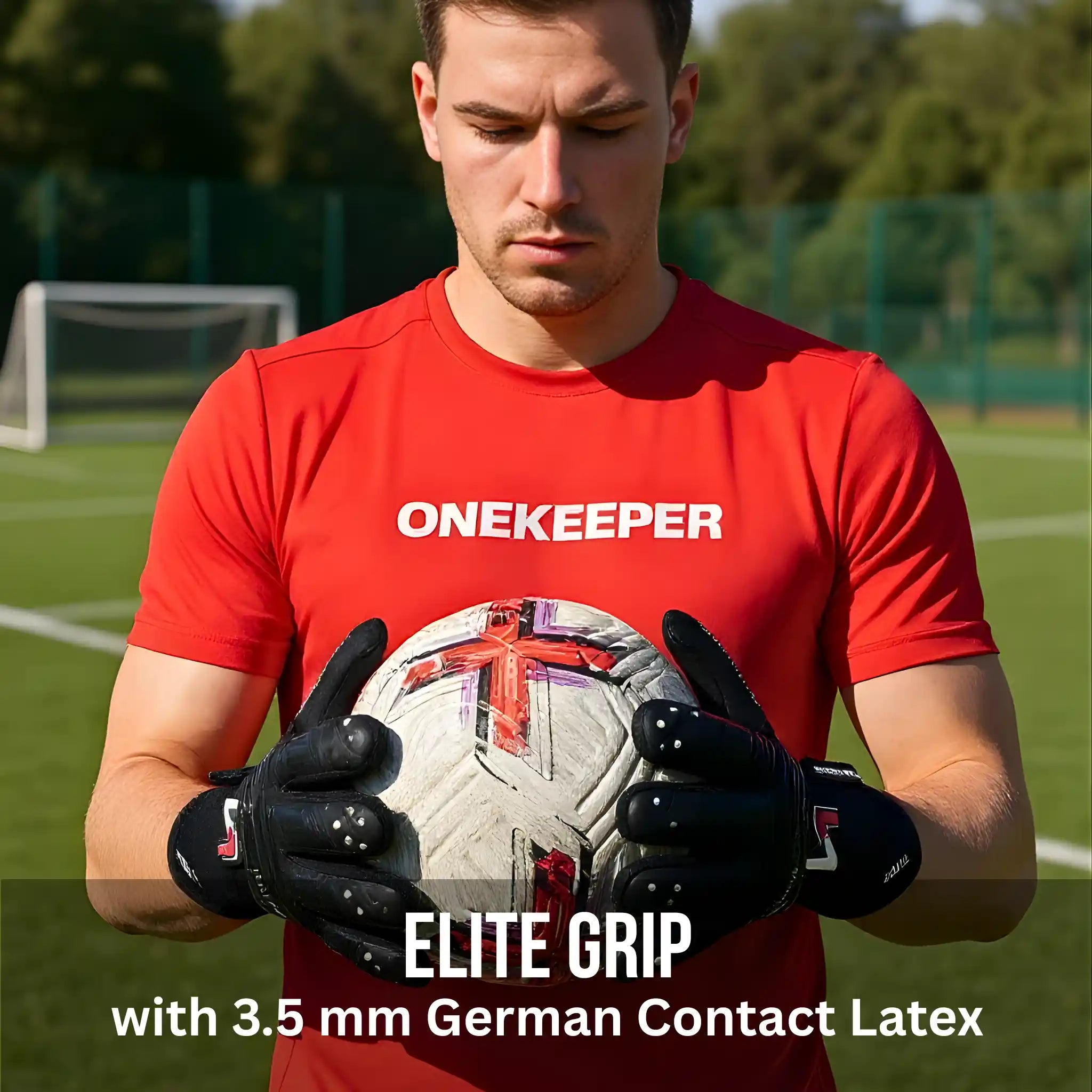 Person wearing a red 'ONEKEEPER' shirt holding a soccer ball on a sports field with a onekeeper viper black gloves.