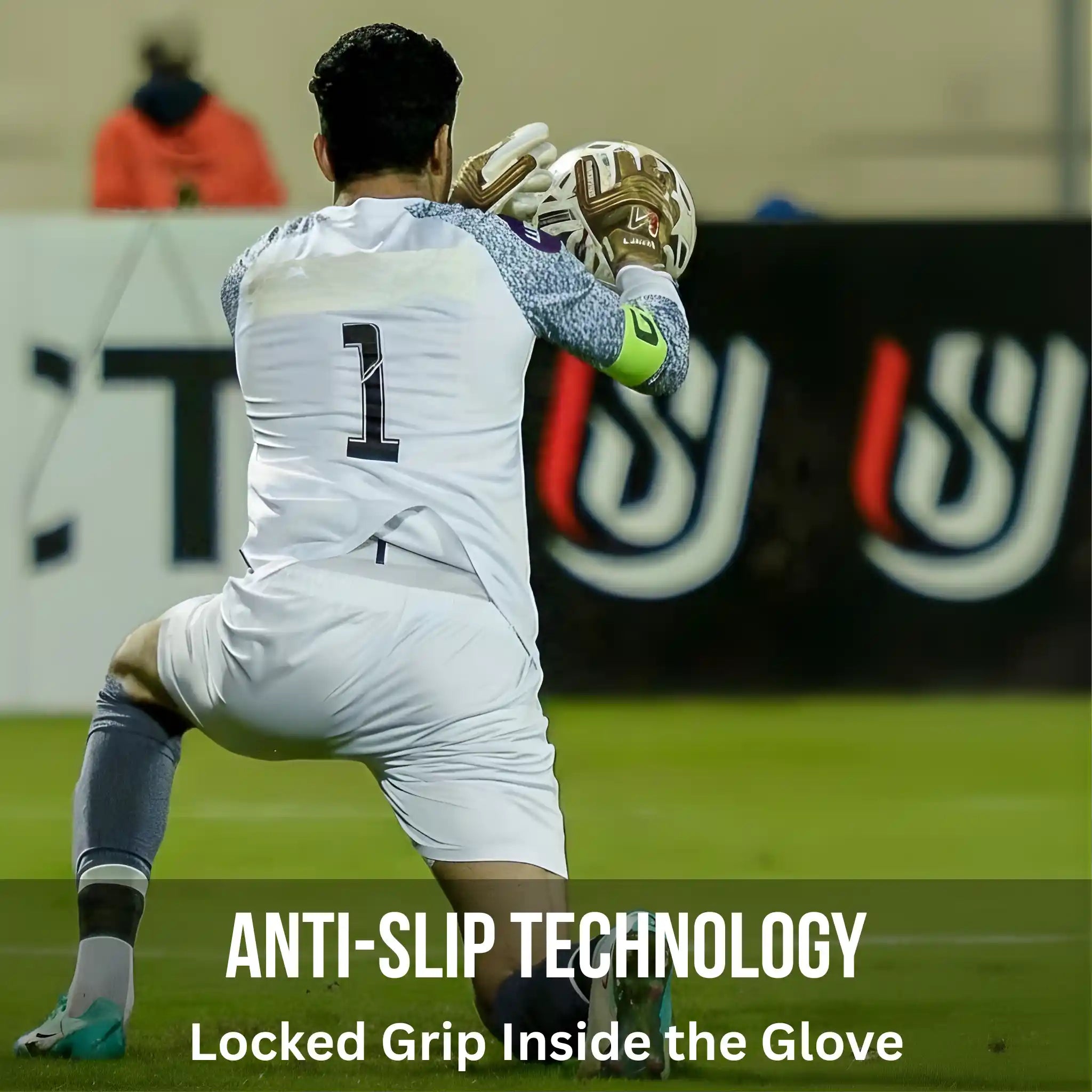 Person in sports uniform with a onekeeper gold goalkeeper glove on a field, promoting anti-slip technology.