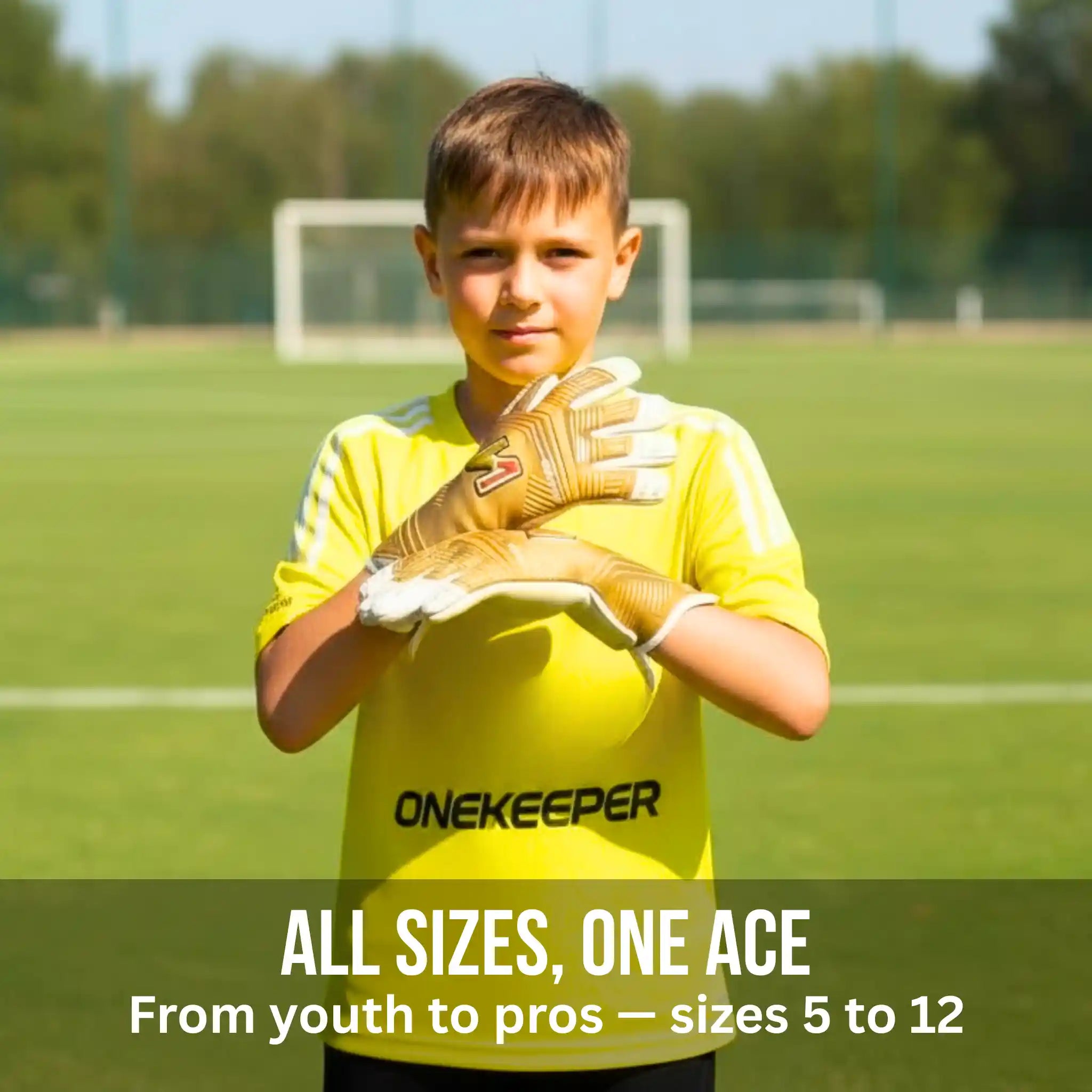 Young boy in a yellow soccer jersey with 'ONEKEEPER viper gold gloves on a soccer field.