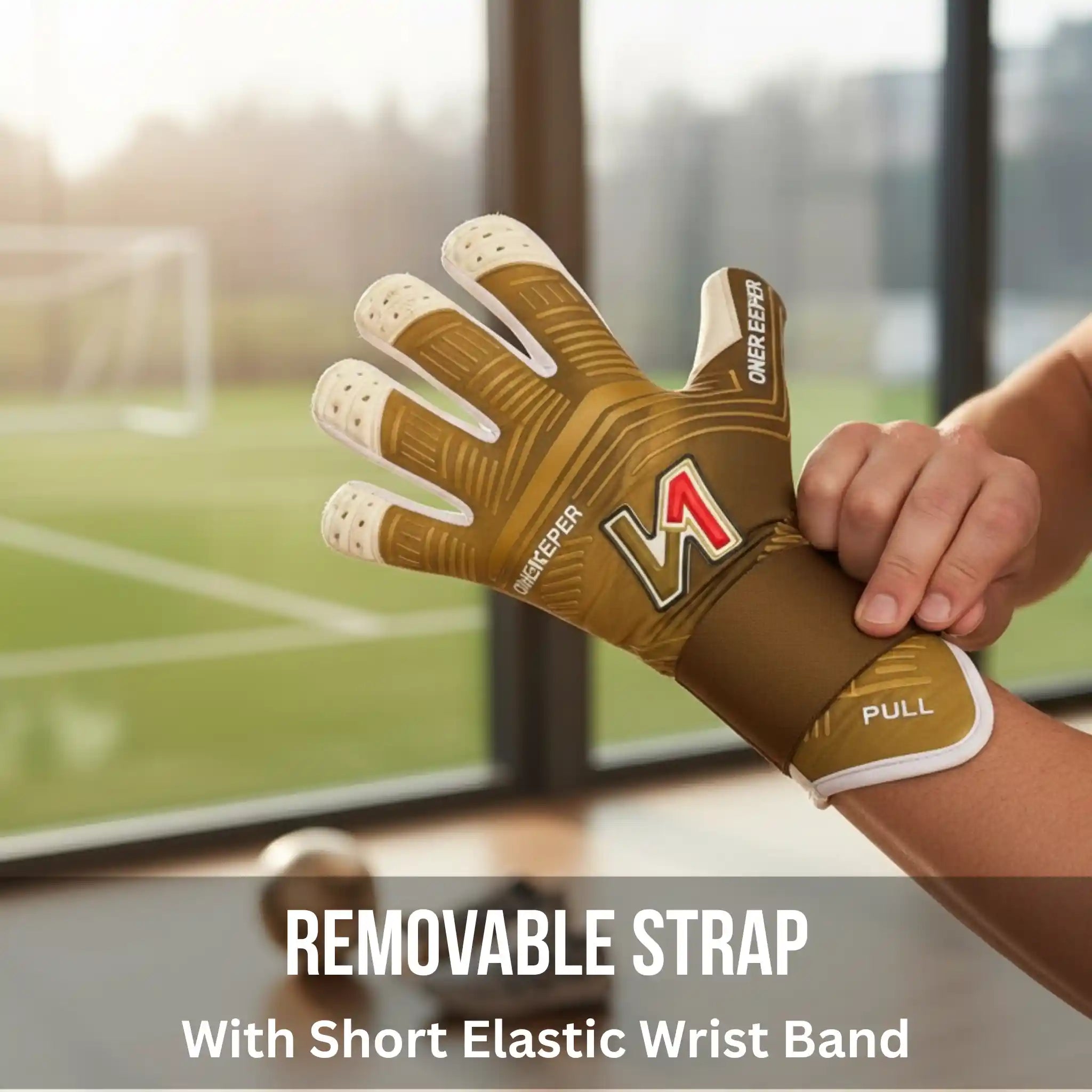 onekeeper viper gold goalkeeper glove with visible branding held by a person, with a blurred sports field background.