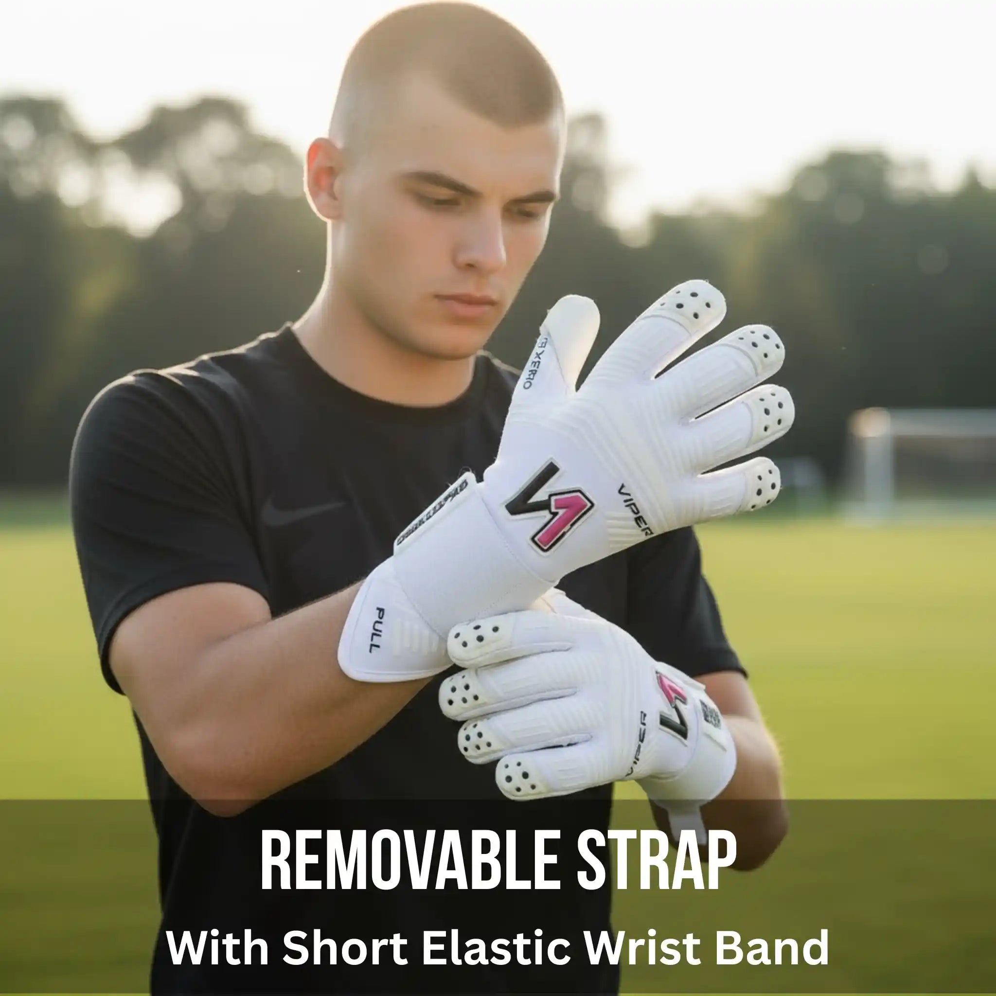 Person wearing a onekeeper viper white gloves with a brand logo on a sports field