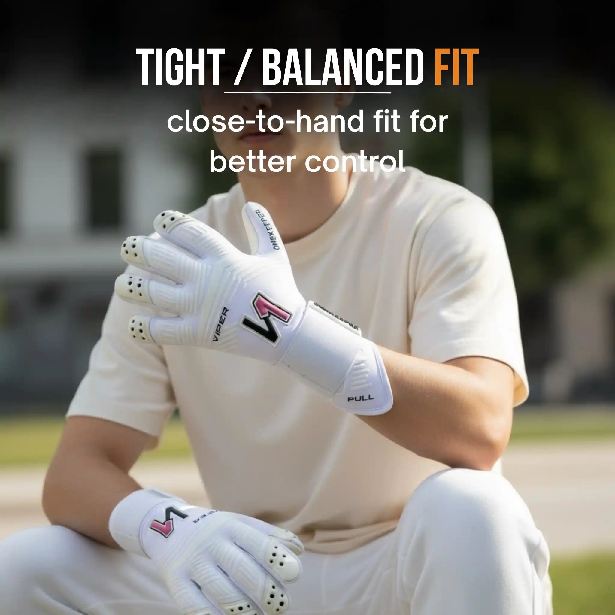 Person wearing a ONEKEEPE Viper whitegloves with text about glove fit on a blurred outdoor background
