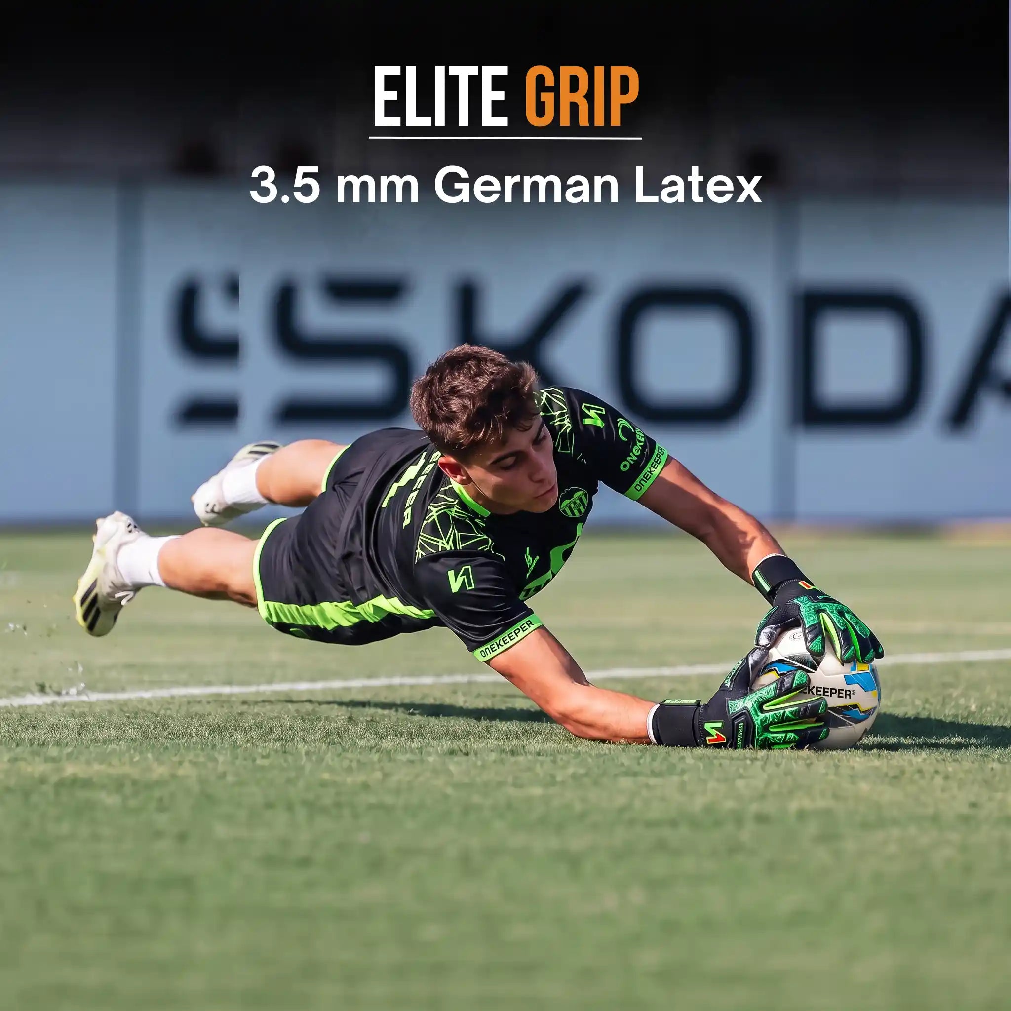 A soccer goalkeeper dives on a grass field wearing a onekeeper legacy black and neon green gloves with a ball, with text overlay reading 'ELITE GRIP 3.5 mm German Latex'.