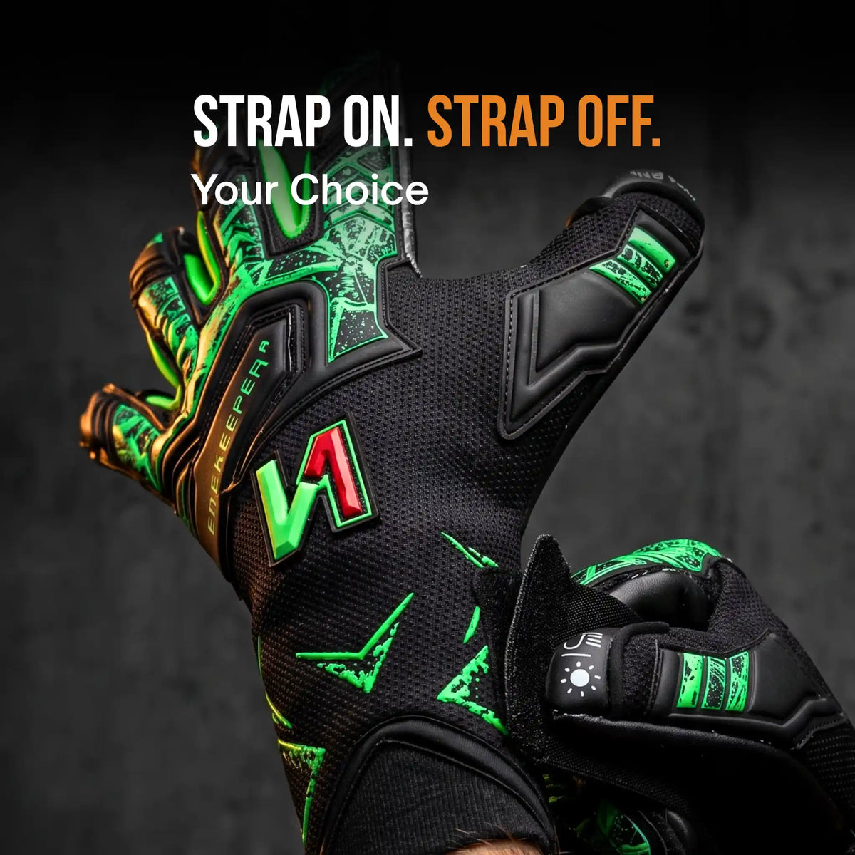 a onekeeper legacy Black and green goalkeeper gloves with bright green and red accents, shown with one glove open and the other closed to demonstrate the strap system. The text 'STRAP ON.