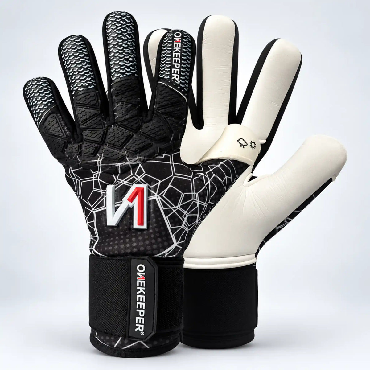 A pair of a onekeeper ctec black goalkeeper gloves shown from both the backhand and palm sides. The gloves feature a black and white geometric pattern on the backhand with a red and white 'M1' logo, white padded finger sections, and black wrist straps with 'OW KEEPER' branding.